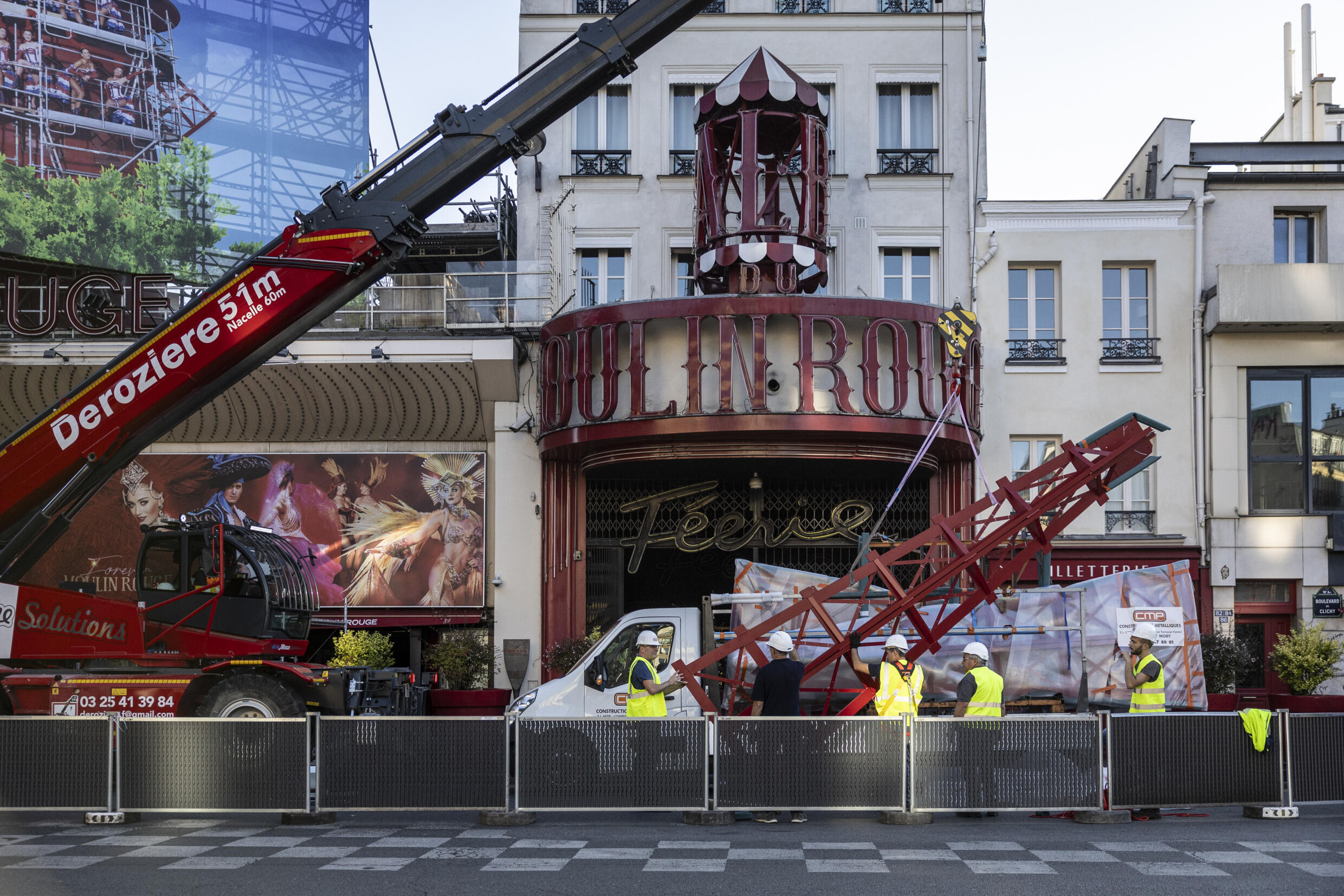 Paris's Moulin Rouge gets new sails just in time for Olympic torch relay