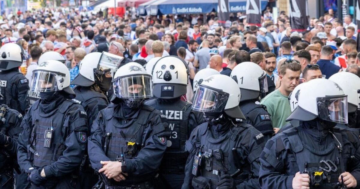 Riot police out in force as England fans take over another German city at Euros