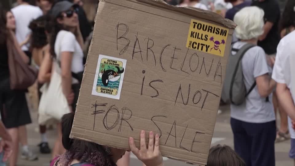 Protesters in Barcelona tell tourists to go home