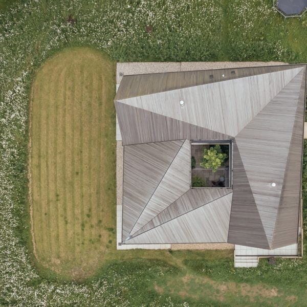 Origami-like roof tops timber home in Suffolk by Studio Bark
