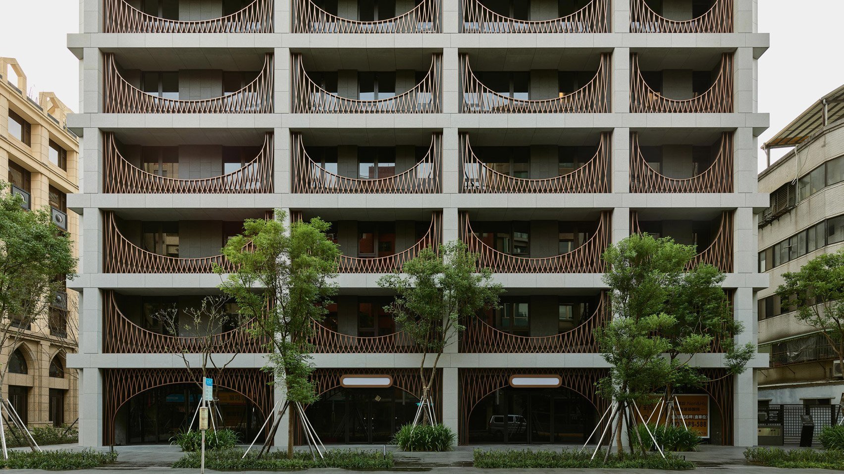 Neri&Hu animates gridded Taipei apartment block with arched screens
