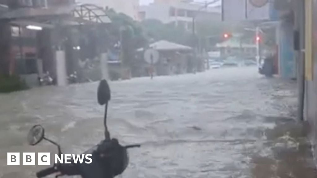 Watch: People rescued as Typhoon floods shops and streets
