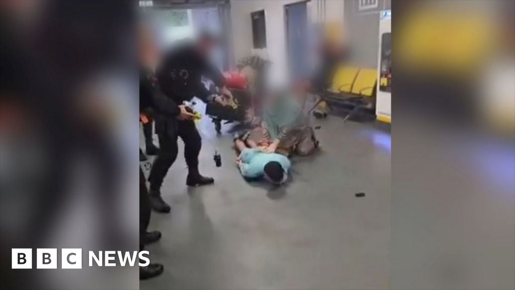 Police filmed kicking man's head at airport