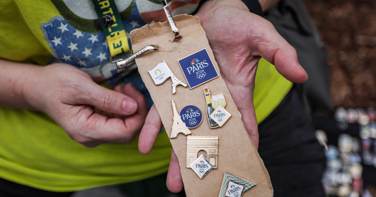 Olympic pin trading fever sweeps social media. What is the tradition and who is taking part?