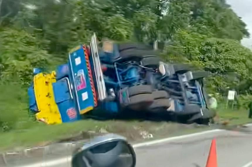 2 men taken to hospital after lorry topples on its side in Lim Chu Kang