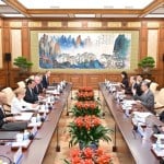 Beijing warns of risks from higher tariffs, urges US business leaders to help mend ties