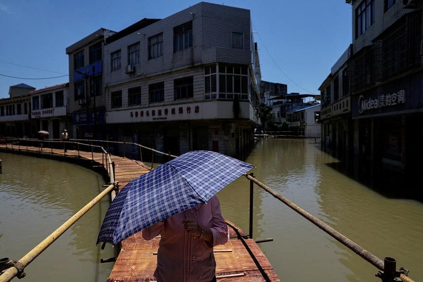 China renews yellow alerts for rainstorms, high temperatures