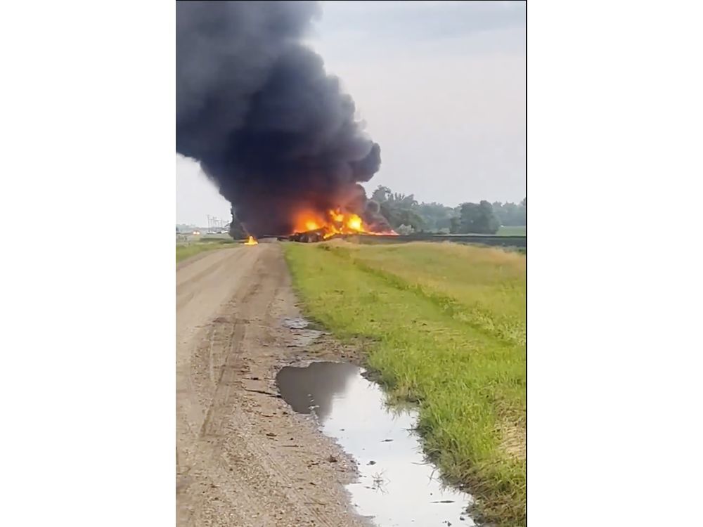 Fiery railcars with hazardous material mostly contained after derailment in North Dakota