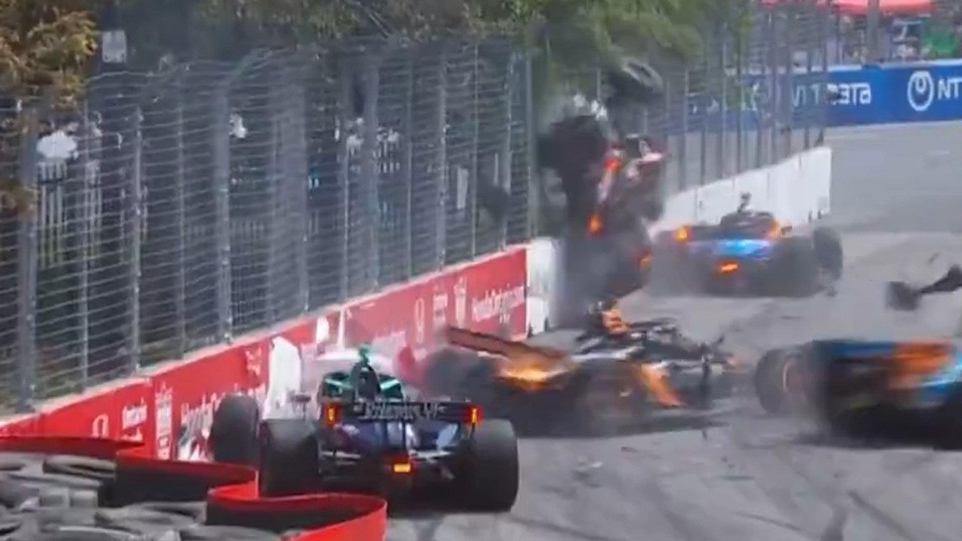 IndyCar driver launched into fence in huge multi-car crash as Toronto race red-flagged to clear debris-filled street