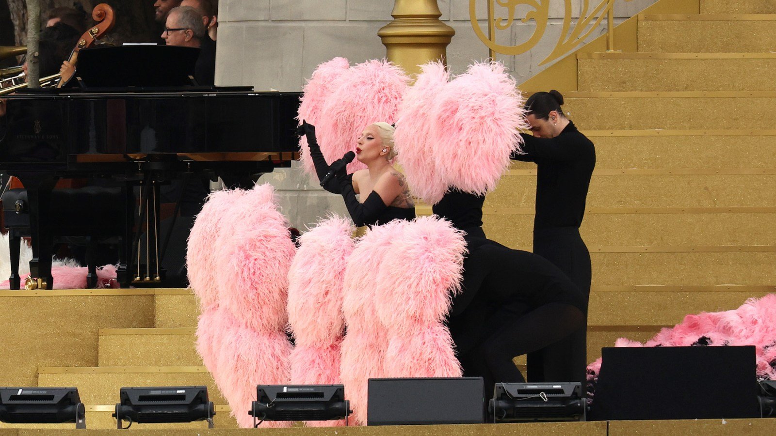 Lady Gaga Sings in French, Bustles With Feathers at Olympics Opening Ceremony Performance
