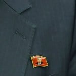 N. Koreans are seen wearing Kim Jong Un pins for the first time as his personality cult grows