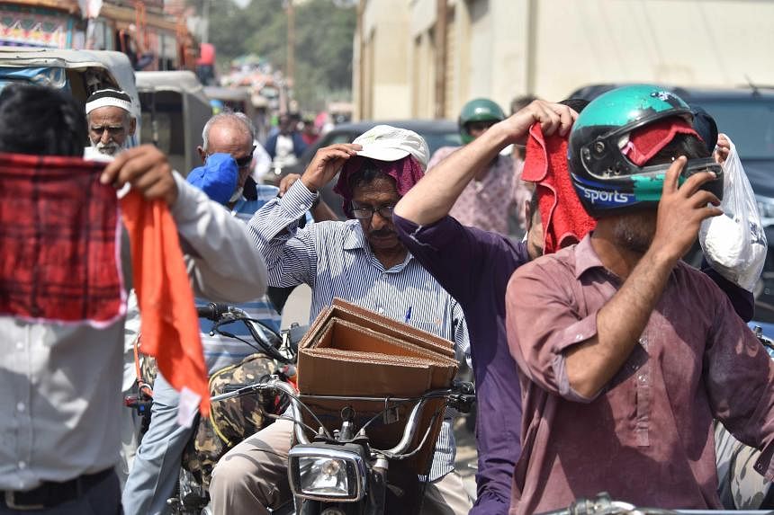 Pakistan withers under deadly heat and fears the coming rains