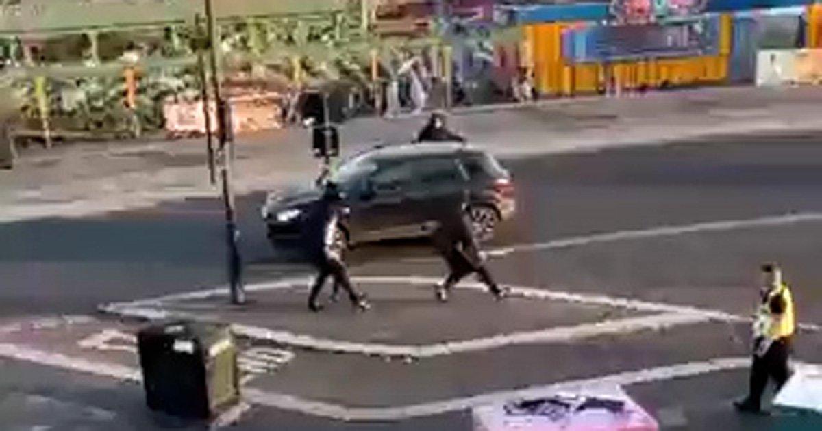 Police watch on as machete-wielding youths fight at seaside town theme park