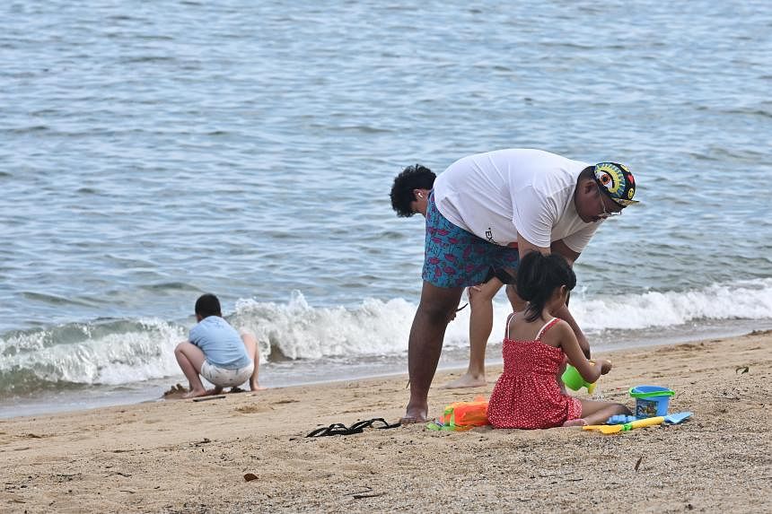 Some enter sea at East Coast Park despite advisories after oil spill; doctors warn of health risks 