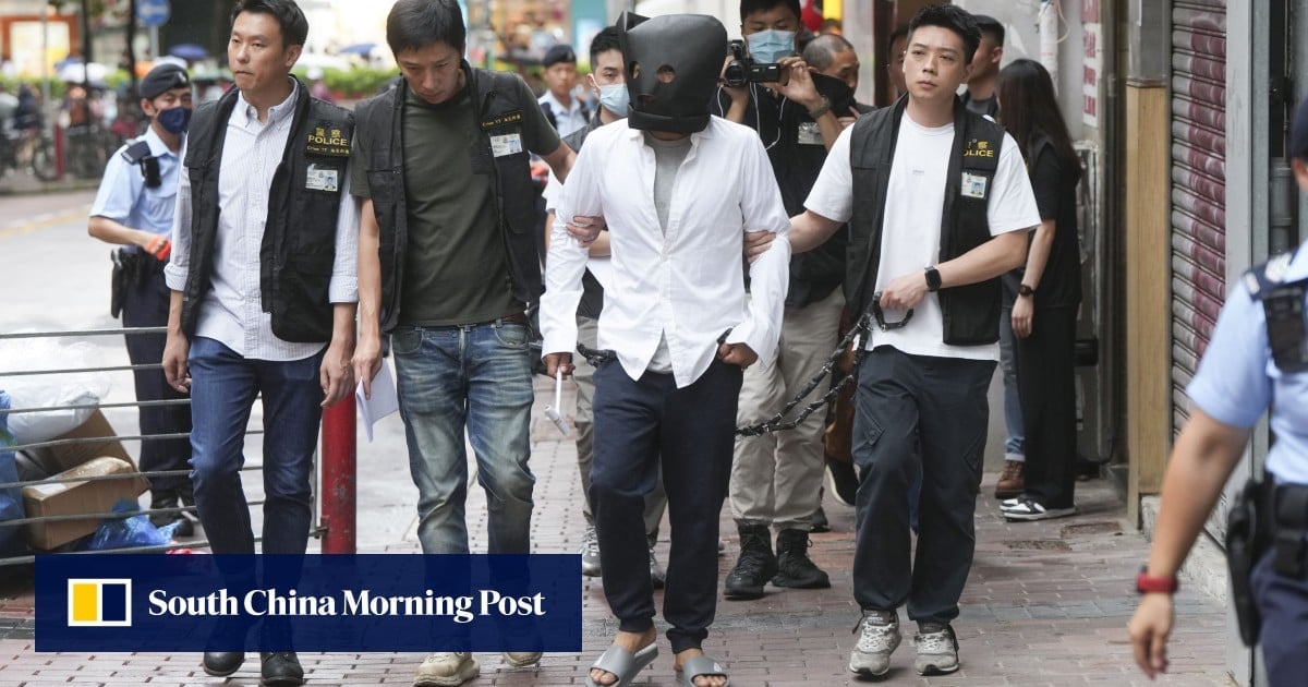 Suspect takes part in police re-enactment of fatal hammer attack at Hong Kong gambling den