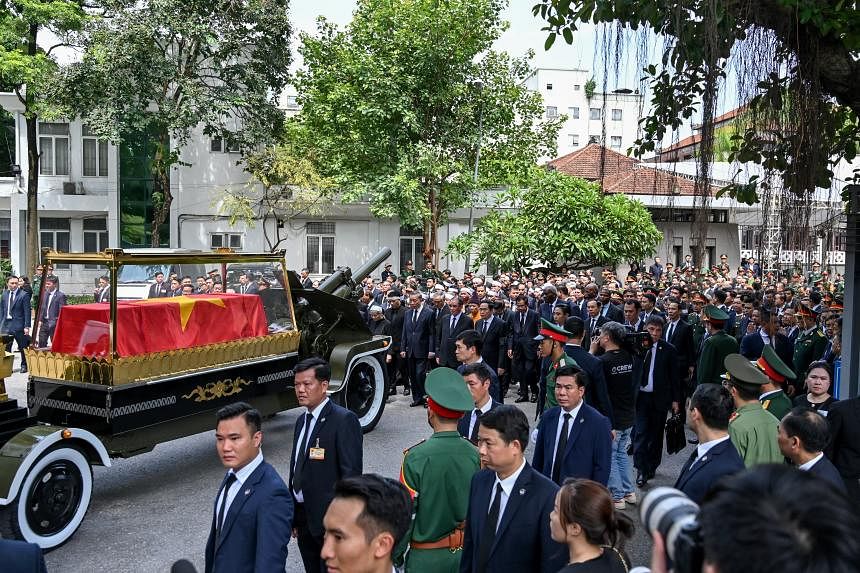 Thousands pay respects as Vietnam leader is buried