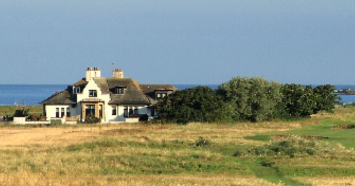 Why is there a house in the middle of Royal Troon and who lives there during The Open?