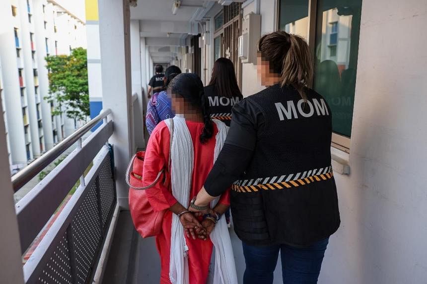 13 migrant domestic workers, 14 errant employers arrested in MOM bust