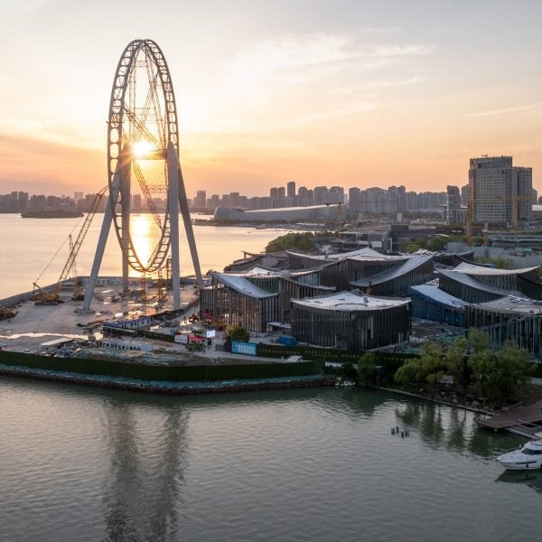 BIG tops waterfront art museum in Suzhou with swooping roof planes