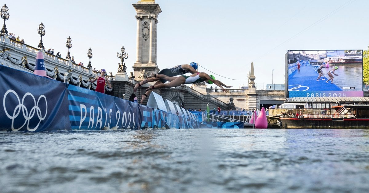 Open Water Swimmers Train in Seine River Ahead of Olympic Marathon Races