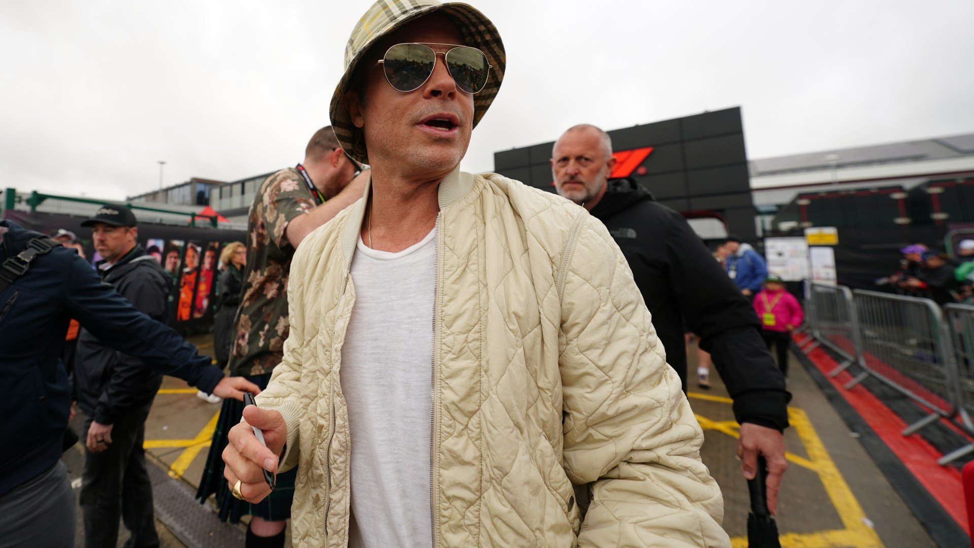 Brad Pitt wears bucket hat & shades as he attends British Grand Prix qualifying while filming F1 movie