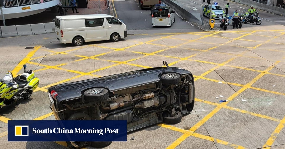 Driver escapes serious injury after van collides with truck, overturns on busy Hong Kong road
