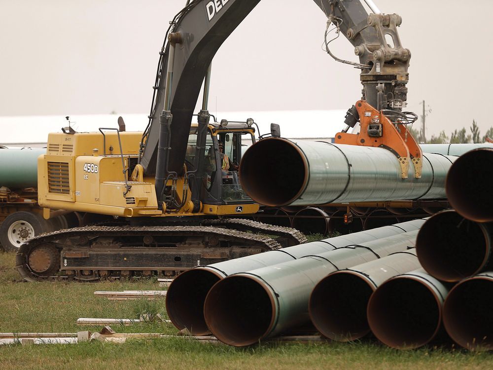 Enbridge makes progress on utility purchases; raises earnings forecast