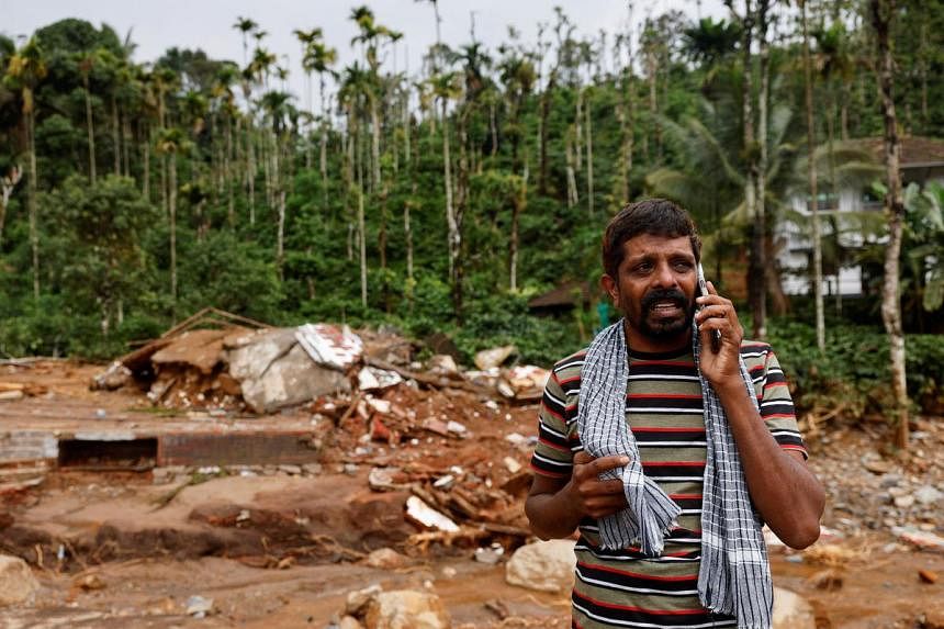 Indian soldiers building metal bridge to marooned area in Kerala landslides