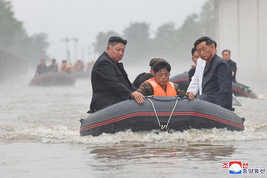 Kim Jong Un wades into North Korean floods in hands-on propaganda drive