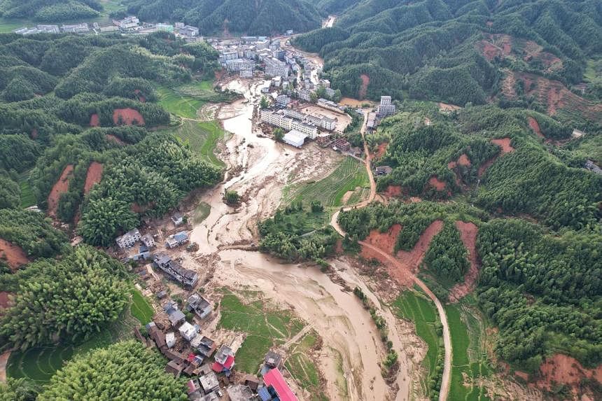 Rescuers in China race to find missing, seal dykes after devastating floods