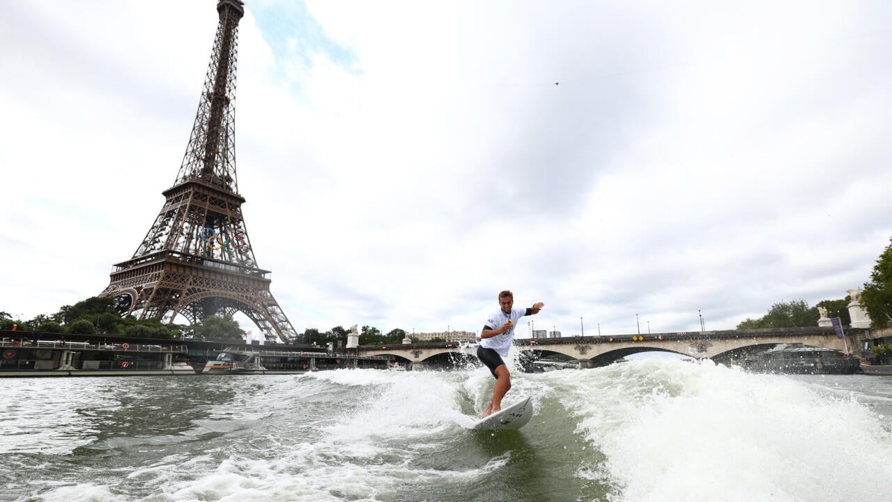 Tahitian surfing champion Kauli Vaast takes victory lap along the Seine