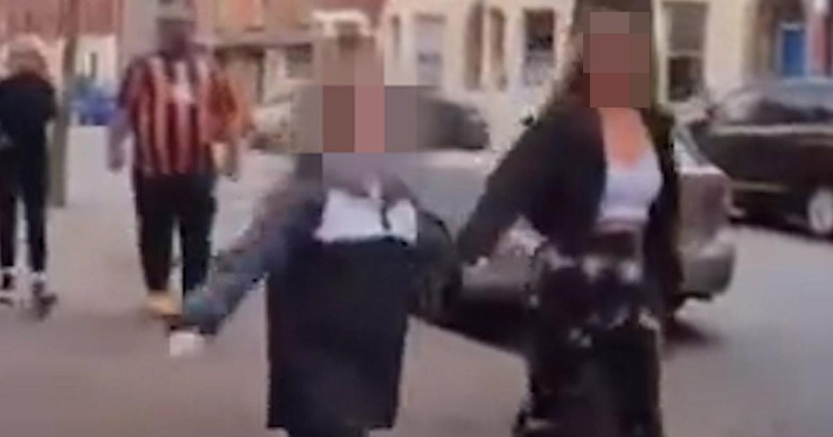 Young girl shouts racist slurs while skipping along street before Belfast protests