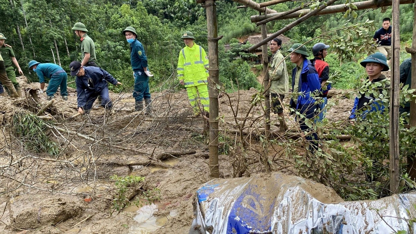 Flood sweeps away a hamlet in Vietnam as death toll after typhoon rises to 155