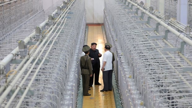 Kim talks of growing nuclear arsenal as North Korea releases uranium facility photos