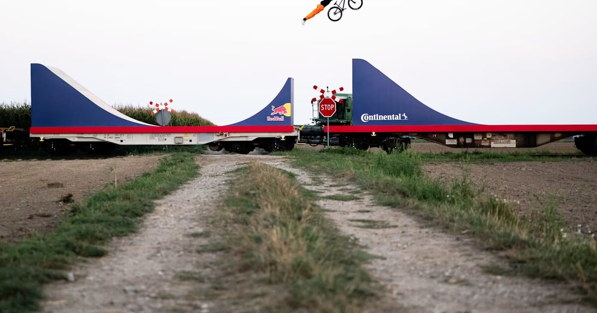 Watch BMX daredevil nail world-first moves on top of a moving train