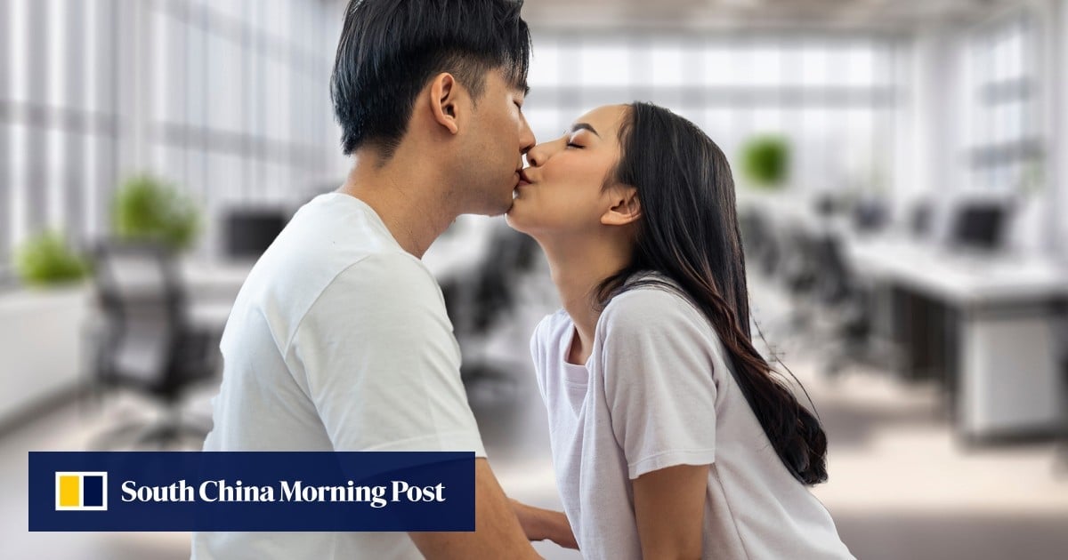 China colleagues, both married to others, fired for kissing in office, sue company