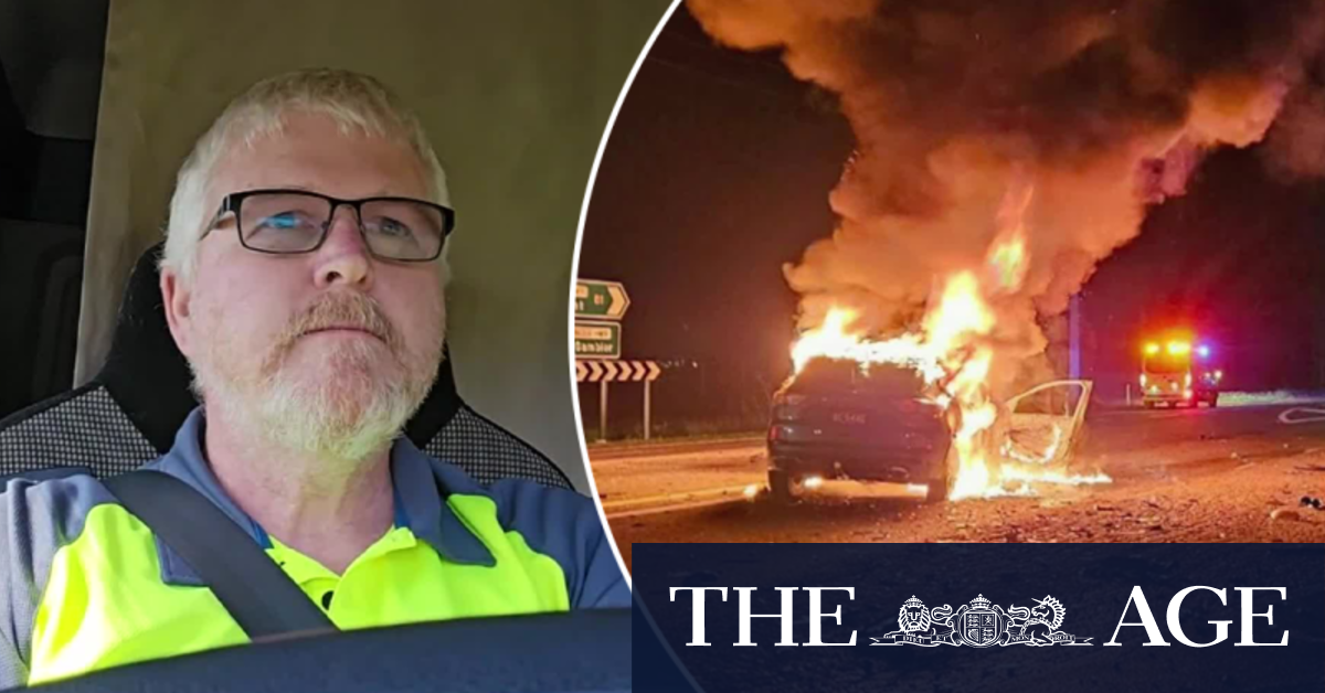 Hero truckie saves woman from burning car