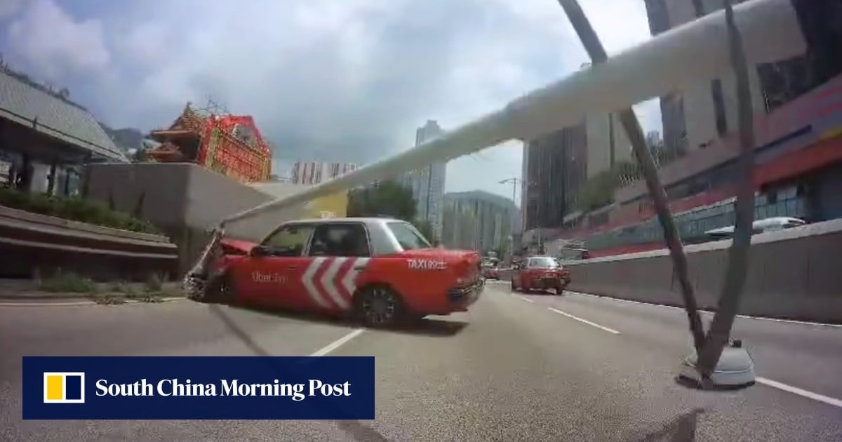 Hong Kong taxi driver, passenger escape serious injury after slamming into barriers, lamp post