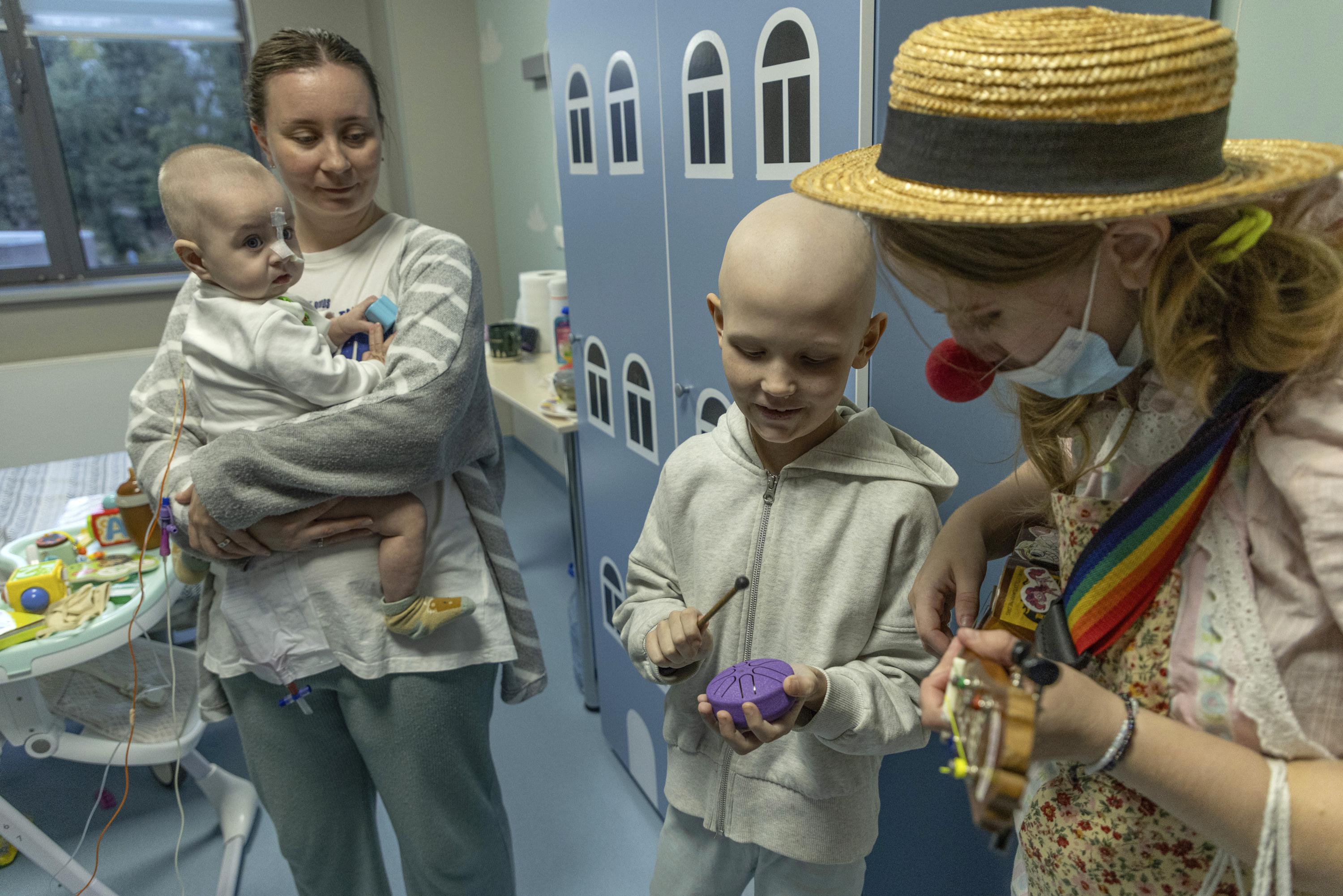 Hospital clowns bring joy to young Ukrainian cancer patients who survived Russian missile attack