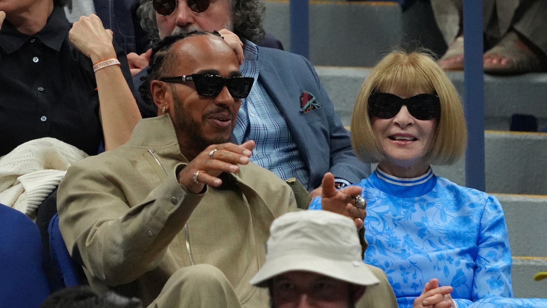 Lewis Hamilton receives fashion advice from Vogue editor Anna Wintour as they watch US Open Final