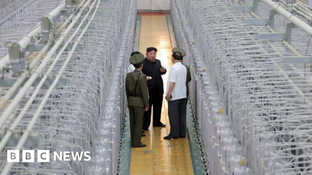 North Korea releases rare photos of Kim in nuclear facility