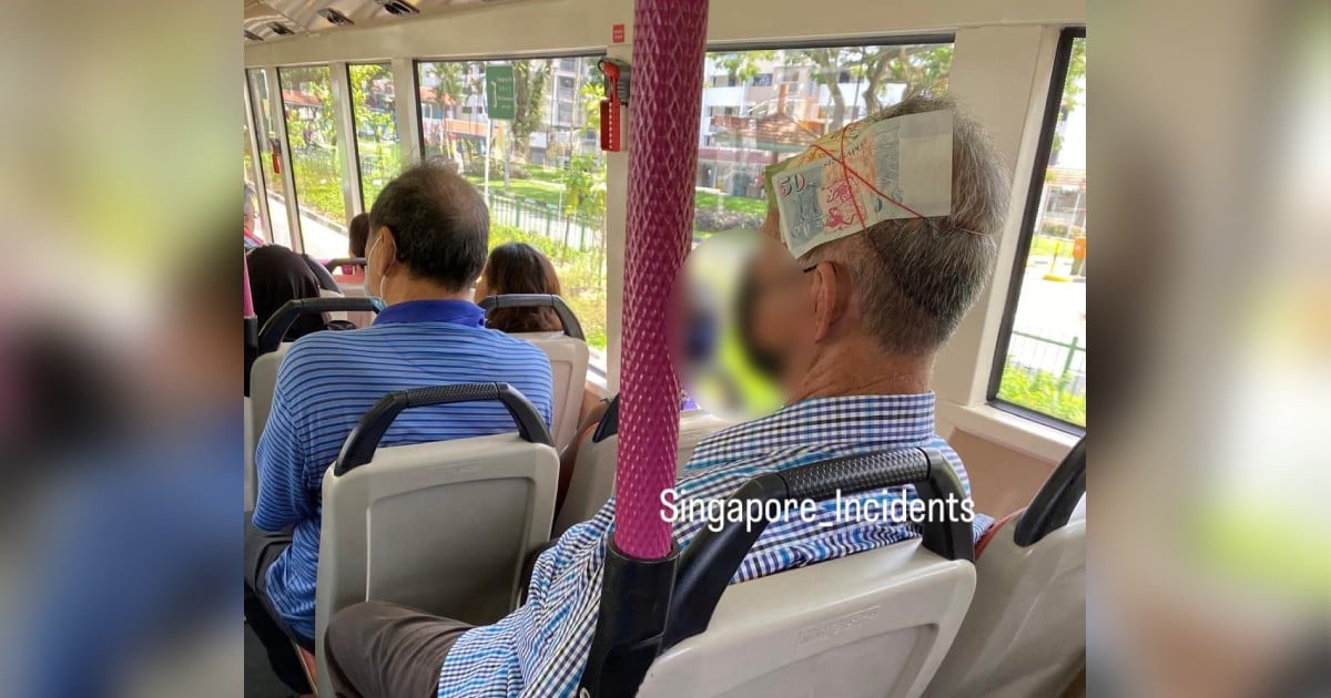 'This is his pain killer': Netizens get creative after man spotted with $50 bill tied to his head on bus 