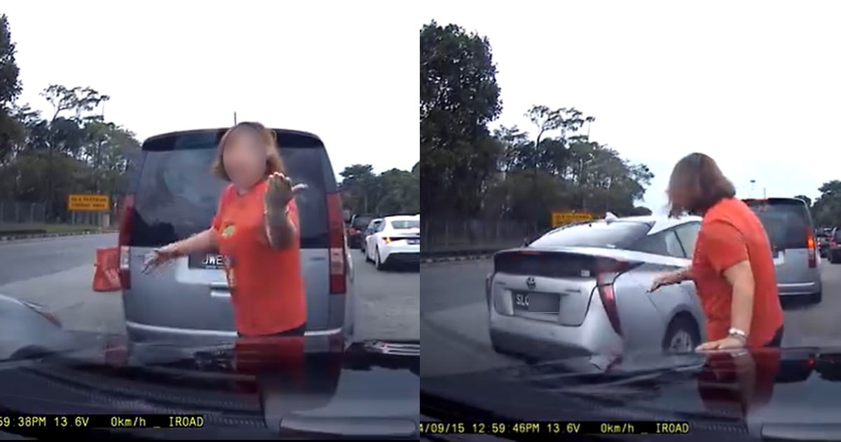 Woman blocks vehicle with her body to allow car to jump queue at Second Link