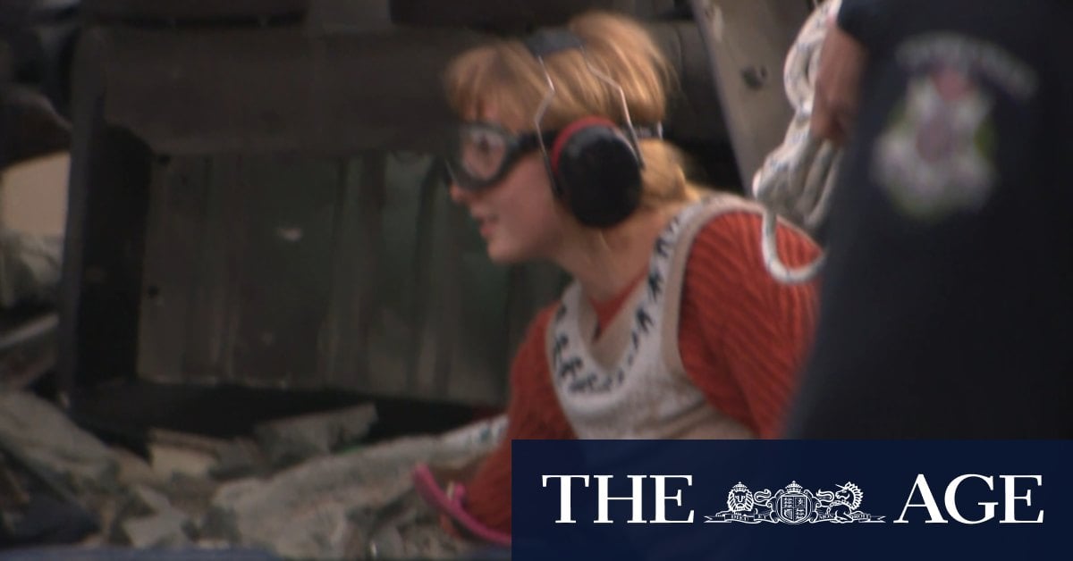 Woman chains herself to car during Melbourne protests