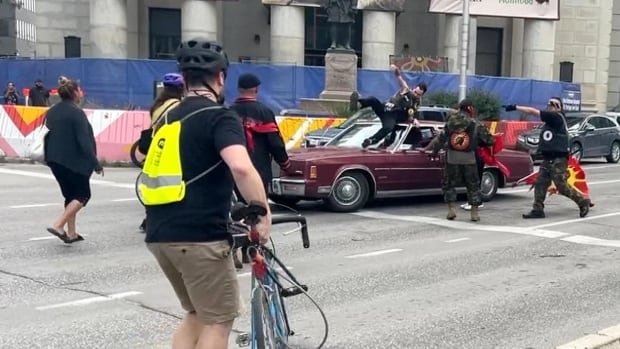 Woman hit after car drives through crowd during Winnipeg protest