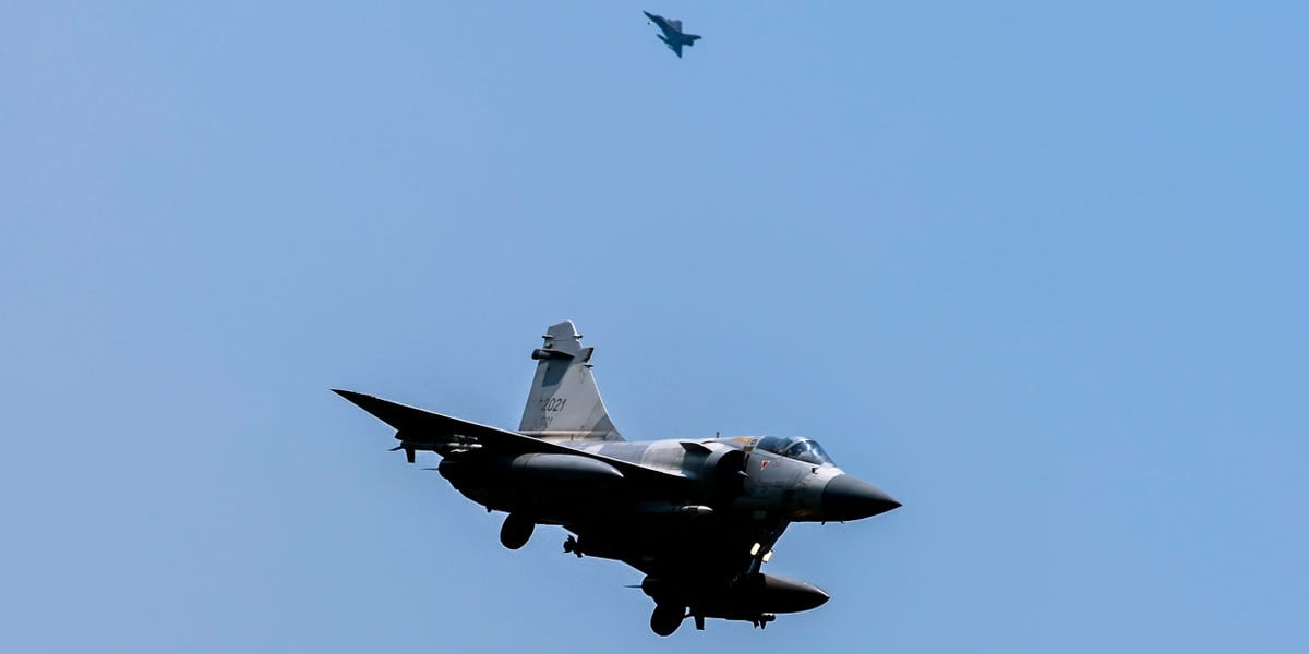 A record-breaking 153 Chinese warplanes flew around Taiwan in war games meant as a warning