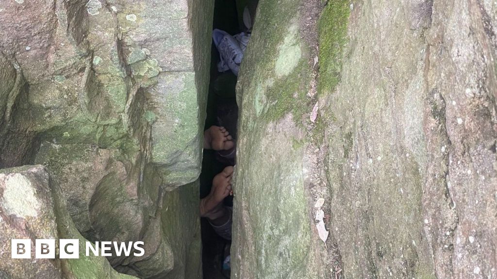 Woman wedged in boulders after trying to reach lost phone is rescued