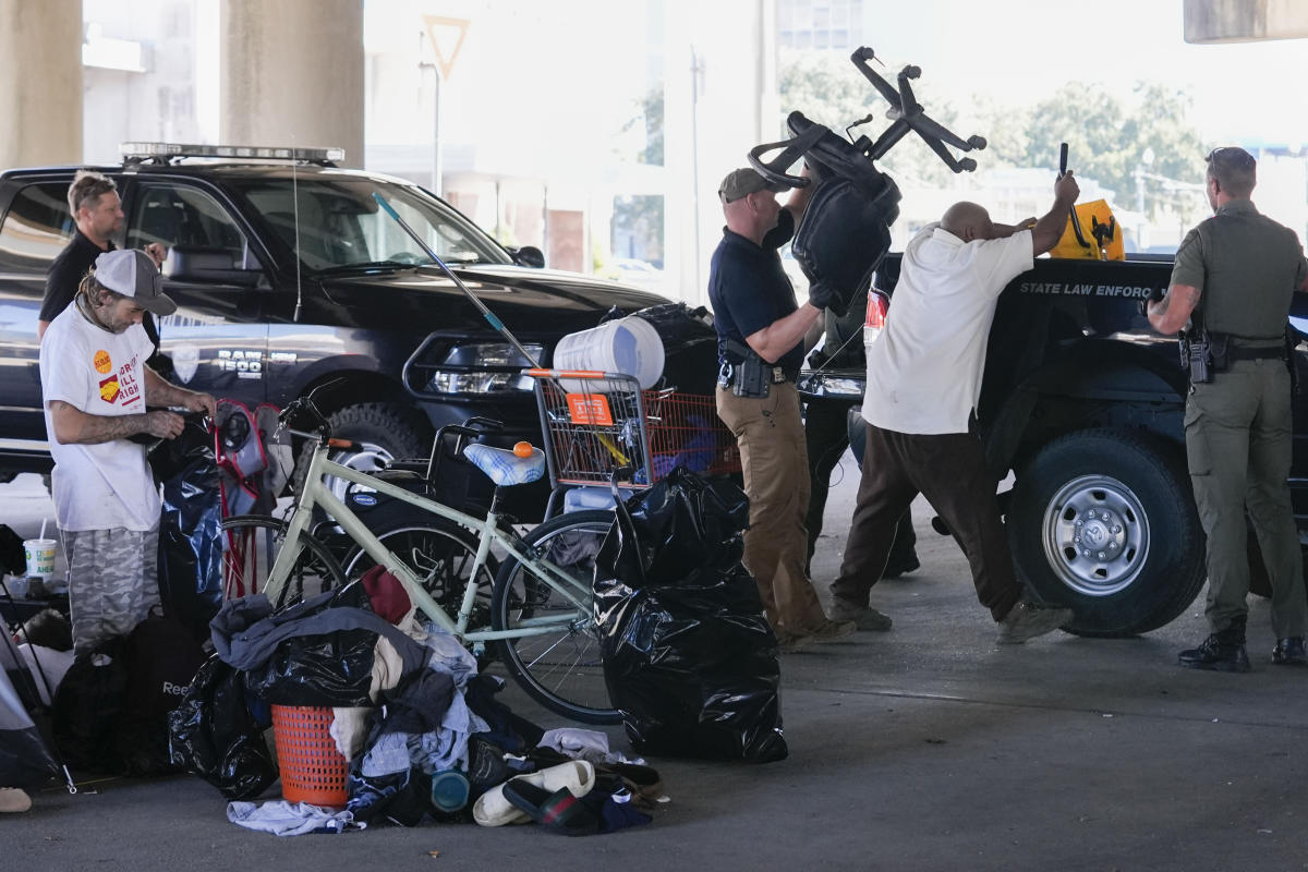 Before Taylor Swift show in New Orleans, a homeless encampment is forced to move