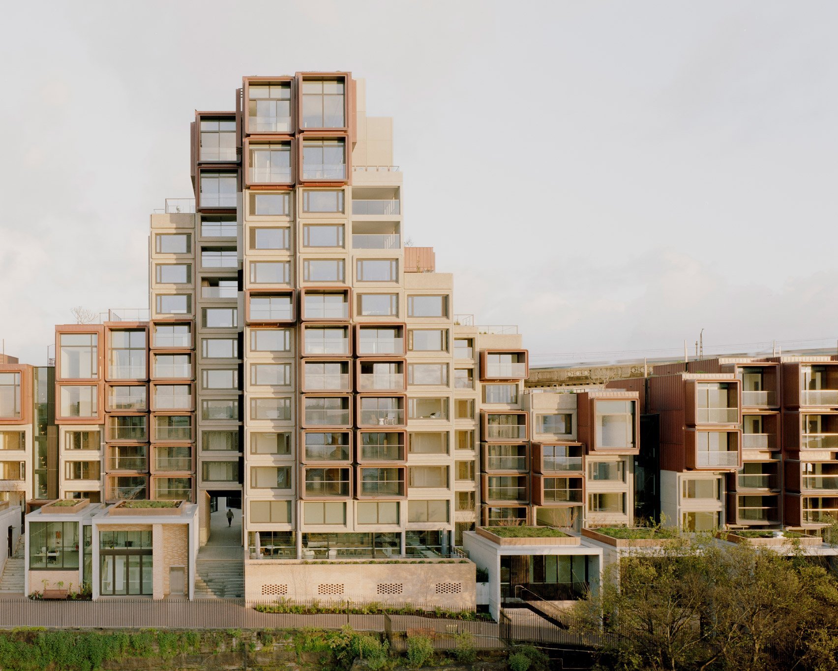 BVN tops Sydney's brutalist Sirius building with copper-pod extensions