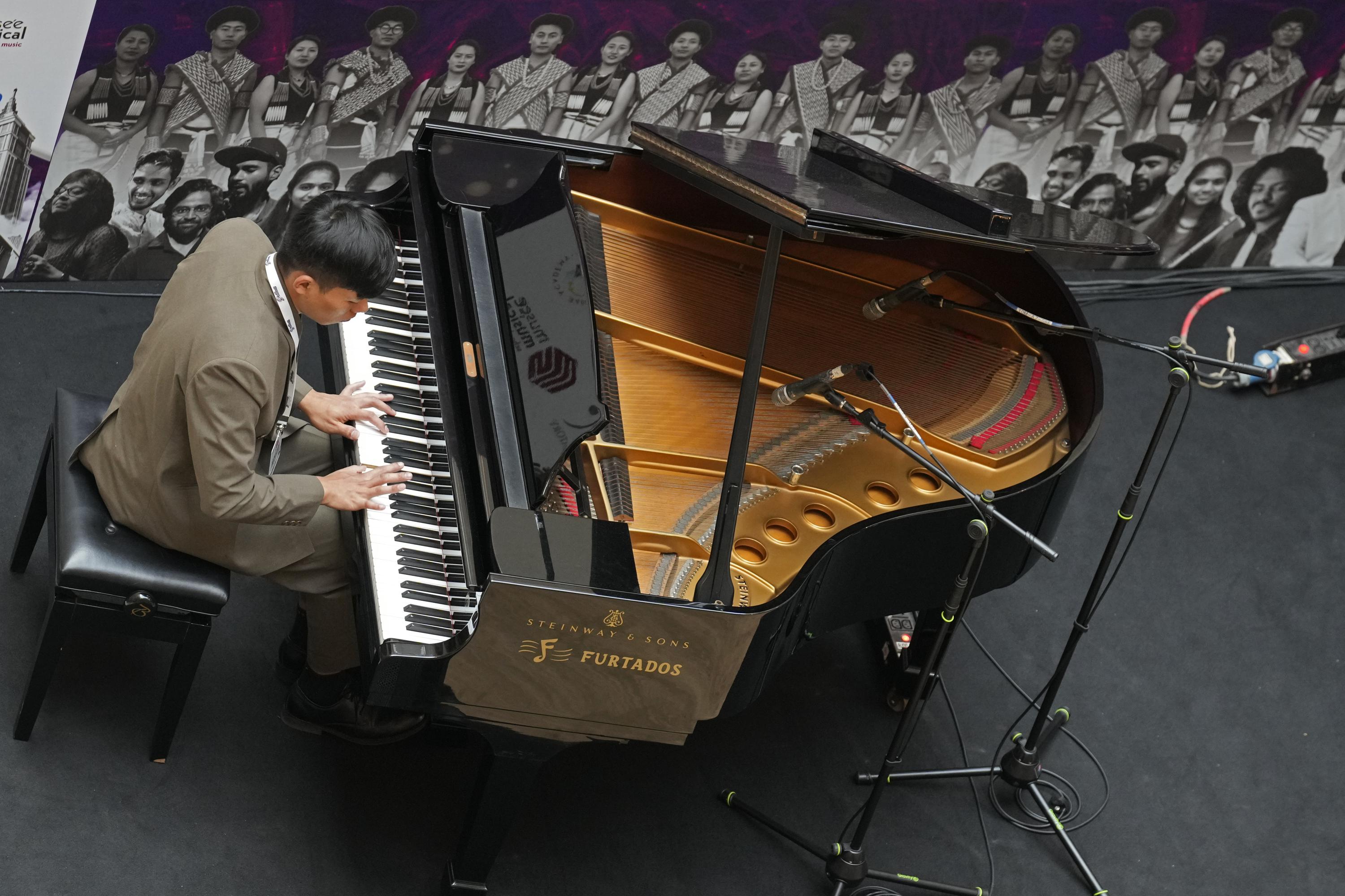 AP PHOTOS: A blind pianist from Nagaland says music is 'one thing that has kept me alive'